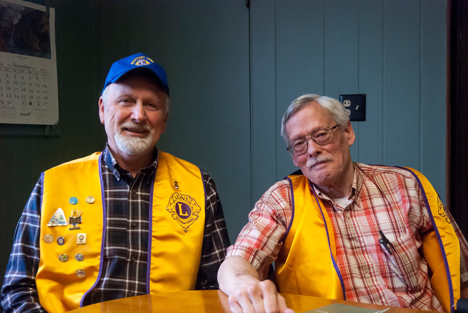 FILE PHOTO — Barry Panush, left, and Bill Hunter, of the Boistfort Lions Club, spoke about the club’s history with the Walk-N-Knock program in Lewis County in 2015.